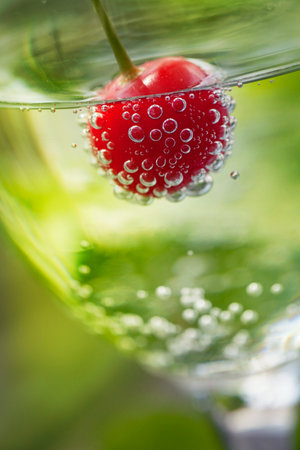 Summer drink. Fizzy soda drink with cherryの写真素材