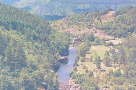 Deserted landscape in France in faded color effect. Lack of tourists on the banks of a mountain...