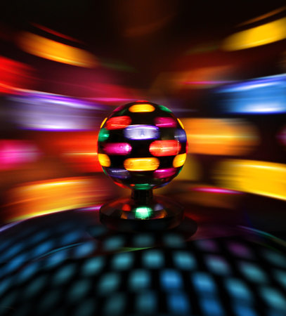 Colorful disco ball rotating light spot reflections on wall
