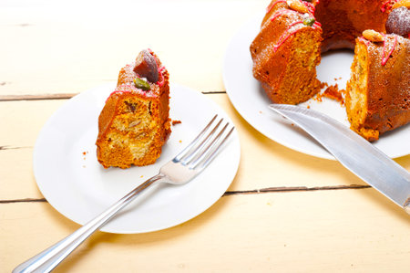 fresh chestnut cake bread dessert with almonds and pistachios on top