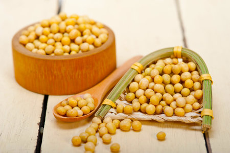 organic soya beans over rustic wood table macro closeup