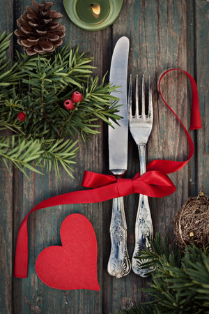 Christmas background with rustic ornaments and fir tree. Xmas vintage concept. Christmas dinnerの写真素材