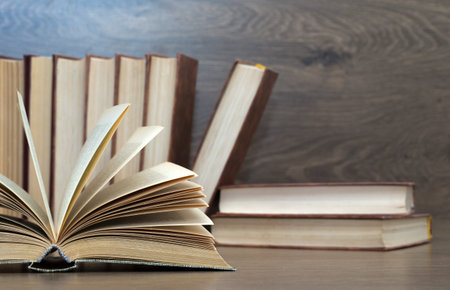 books on wooden deck tabletop
