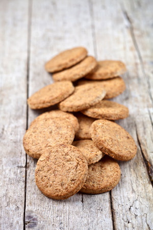 Fresh baked oat cookies on rustic wooden table background.の写真素材