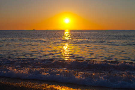 Red sunset over the sea. Beautiful sunset. Tyrrhenian Sea sunset in Calabria, Italy.の写真素材