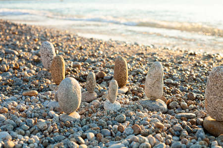 Beautiful seascape, amazing view of pebble coastline in mild sunset light, romantic evening on the beach.の写真素材