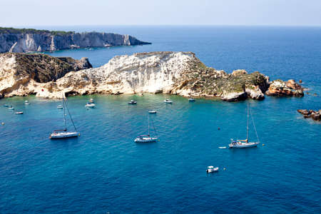 View of the Tremiti Islands. San Domino island, Italy: scenic view of tipycal rocky coastline. Adriatic Sea. Puglia, Italy.の写真素材
