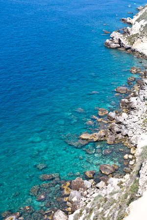 View of the Tremiti Islands. Overview of rock stone coast. San Domino island, Italy: scenic view of tipycal rocky coastline. Adriatic Sea. Puglia, Italy.の写真素材