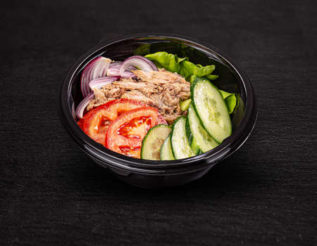 Fresh salad with tuna, lettuce, cucumber, onion and tomatoの写真素材