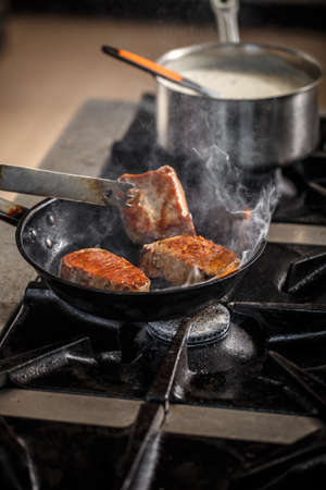 Piece of pork meat frying in the panの写真素材