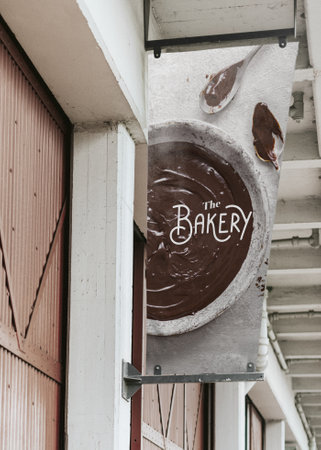 Bakery shop signage with melted chocolate backgroundの素材