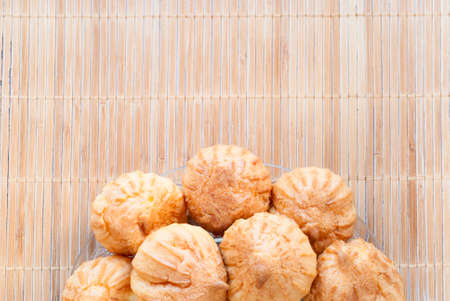 eclairs lie on the bamboo backgroundの写真素材