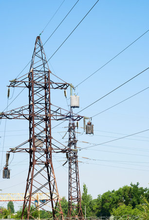 huge electric pole with wires and insulators
