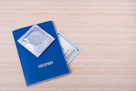 passport, money and a condom on the table