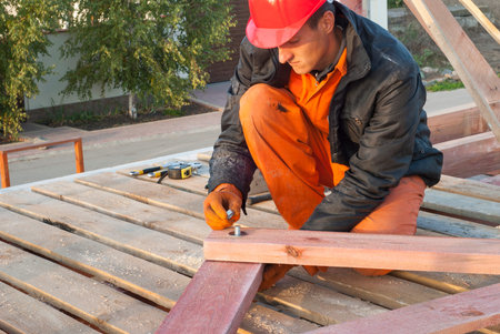 Builder tighten the screws on the connecting pin