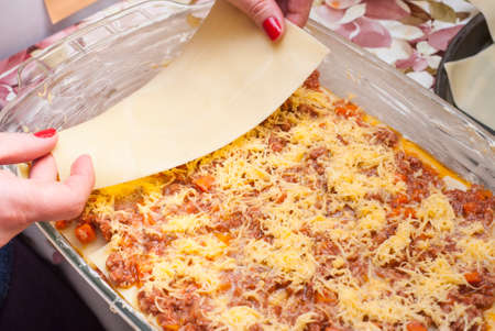 woman cook a delicious lasagna at homeの写真素材
