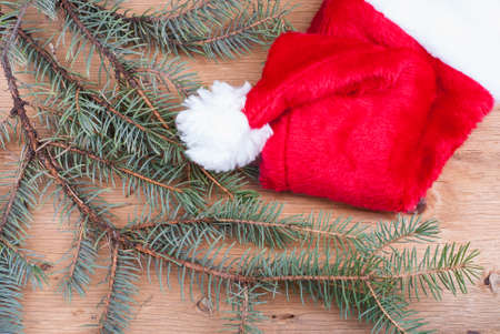 background with fir branches on wooden textureの写真素材