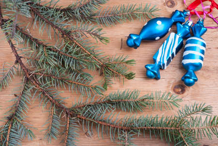 background with fir branches on wooden textureの写真素材