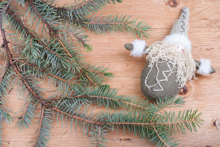 background with fir branches on wooden textureの写真素材
