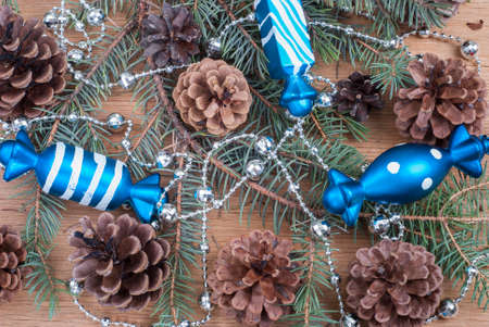 background with fir branches on wooden textureの写真素材