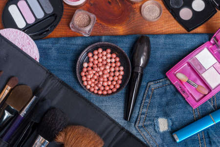 background various women's beauty accessories lie on denimの写真素材