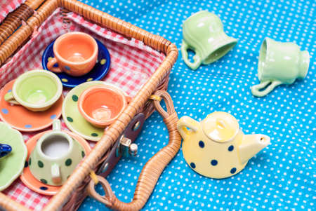 many colored ceramic dishes laid out on a blue backgroundの写真素材
