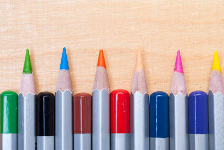 pencils of different colors on the tableの写真素材