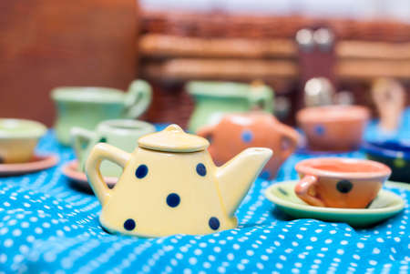 many colored ceramic dishes laid out on a blue backgroundの写真素材