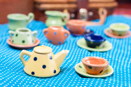 many colored ceramic dishes laid out on a blue backgroundの写真素材
