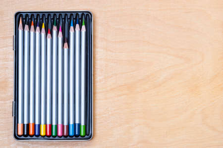 pencils of different colors on the tableの写真素材