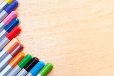 pencils of different colors on the tableの写真素材