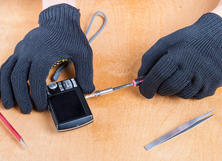 master at work repairing a digital camera