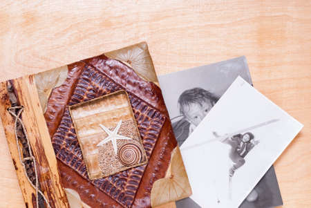 photo album and old photos on the tableの写真素材