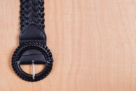 belt buckle on the background of wood texture