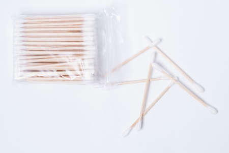 hygienic ear sticks laid on white tableの写真素材