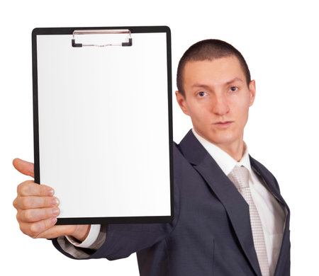 young man in a business suit holding a sheet of paper