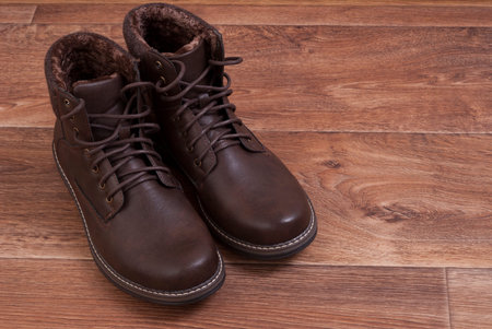 brown men's shoes standing on the floorの写真素材