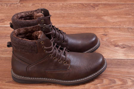 brown men's shoes standing on the floorの写真素材