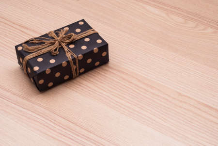 gift in a beautiful package is on the tableの写真素材