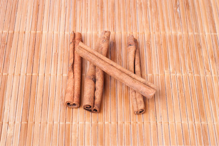 cinnamon sticks on a bamboo table cloth