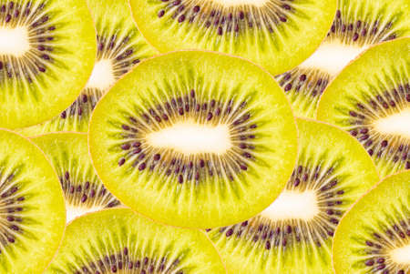 saturated background of sliced juicy kiwi fruitの写真素材