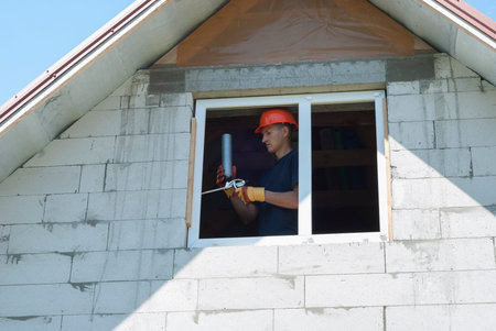construction worker sets of metal and plastic window