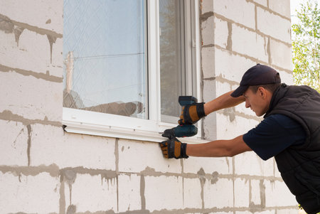 construction worker sets of metal and plastic window