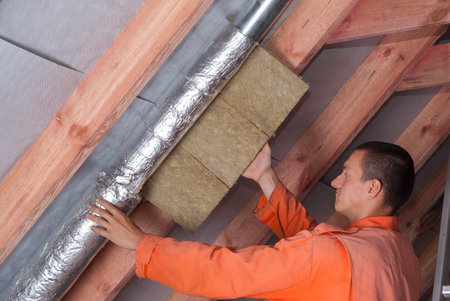 installer wraps the air duct with mineral wool and foil