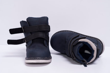 blue children's boots on a white background