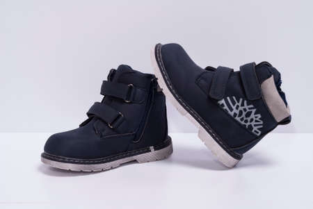 blue children's boots on a white backgroundの写真素材