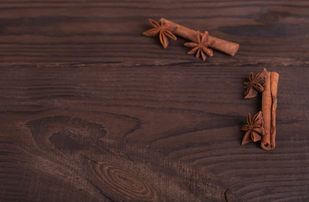 Star anise and cinnamon on a wooden background