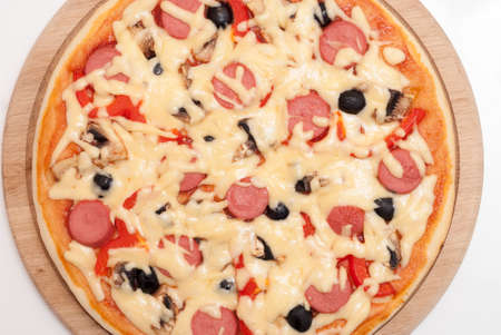 appetizing freshly baked pizza on the tableの写真素材