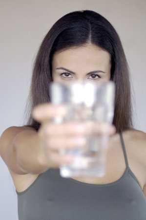 Woman holding glass of waterの写真素材