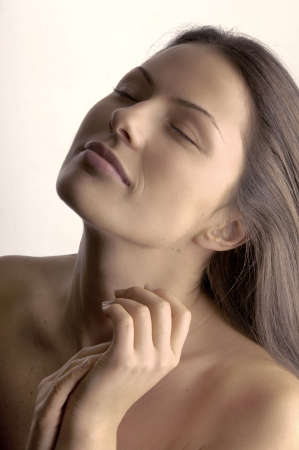 woman caressing her handsの写真素材